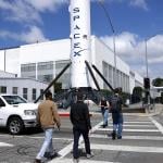 People walk outside a SpaceX facility in Hawthorne, California.