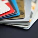 A stack of multicolored credit cards. 