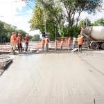 Construction workers doing road works and tram tracks repair. 