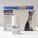 Wegovy semaglutide tablets on a white background with Ozempic and Wegovy injection pens.
