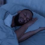 A person sleeping well in a bedroom.