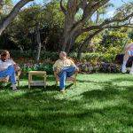 A family enjoying their time in the house yard.