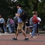 Students walking to their classes in a university town in Ann Arbor, Michigan, USA.