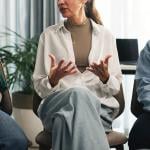 A small group of employees discussing about stress management in the workplace.