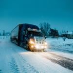 A truck passing on a road during a blizzard in Gaspe, Quebec, Canada.