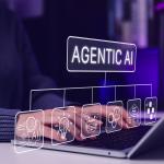 Agentic AI software graphics illustrated over a person using a laptop.