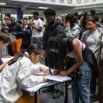 Students queue to get their GCSE results at City Of London Magistrates Court on August 21, 2025 in London, England. 