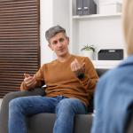 A professional psychologist during a session with a patient in a clinic.