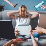 A creative image of a young woman trying to shut out digital devices as a concept of digital detox.