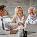 A senior couple having a meeting with a financial advisor.