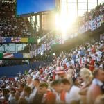 Crowds cheering during a soccer match.