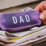A velvet-covered eyeglasses case with a "Best Ever Dad" inscription.