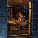 A view from the window of a female creative professional working late at night.