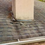 A roof's shingles damaged from a water leak.
