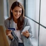 A female entrepreneur paying an online purchase with a credit card.