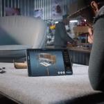 A designer creating a 3D model of a wooden bedside table through a AI software for furniture design.
