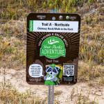A sign with a QR code on the trail at Chimney Rock National Historic Site in Nebraska