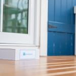 A package box labeled from pharmacy left on the front porch of a house as a delivery.