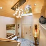 A grand entry foyer of a luxury home with multi-glass ball chandelier.