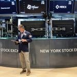 Traders work on the floor of the New York Stock Exchange during morning trading on June 26, 2026 in New York City. 