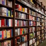 Books displayed for sale on shelves at Barnes & Noble bookstore in New York City, USA.
