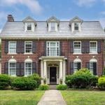 A colonial revival brick house in Newton, Massachusetts.