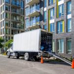 A moving truck in the city.