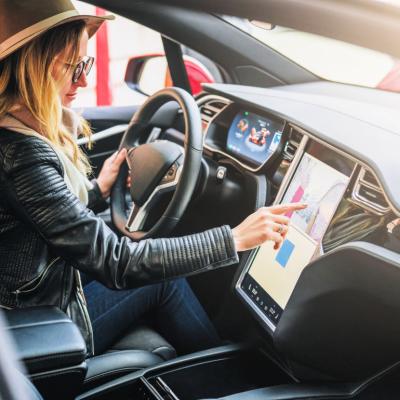 Person operates electronic dashboard in Tesla