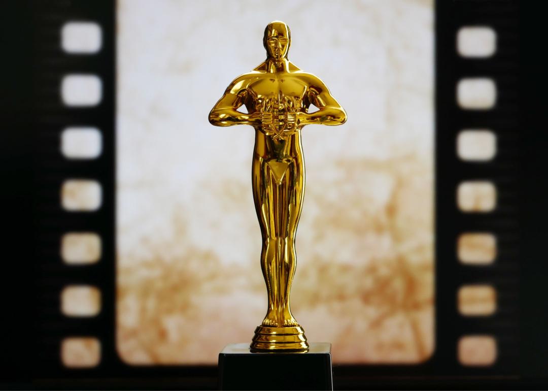 Award statue with film background.
