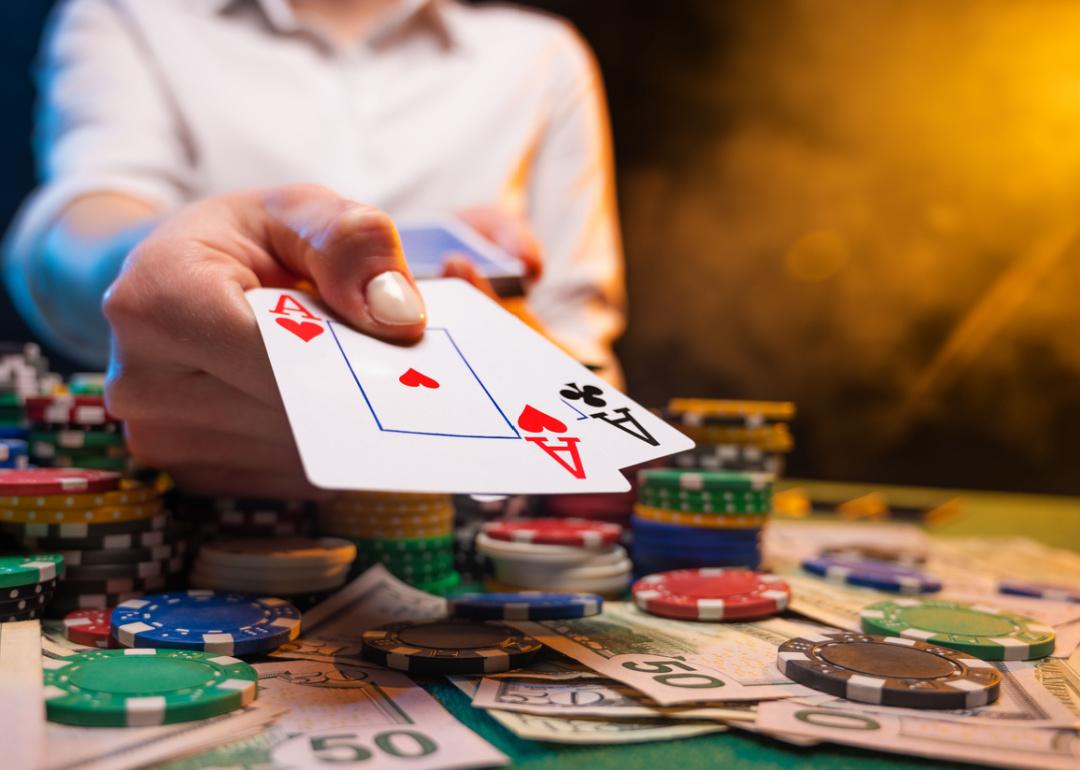 Player with two aces in casino.