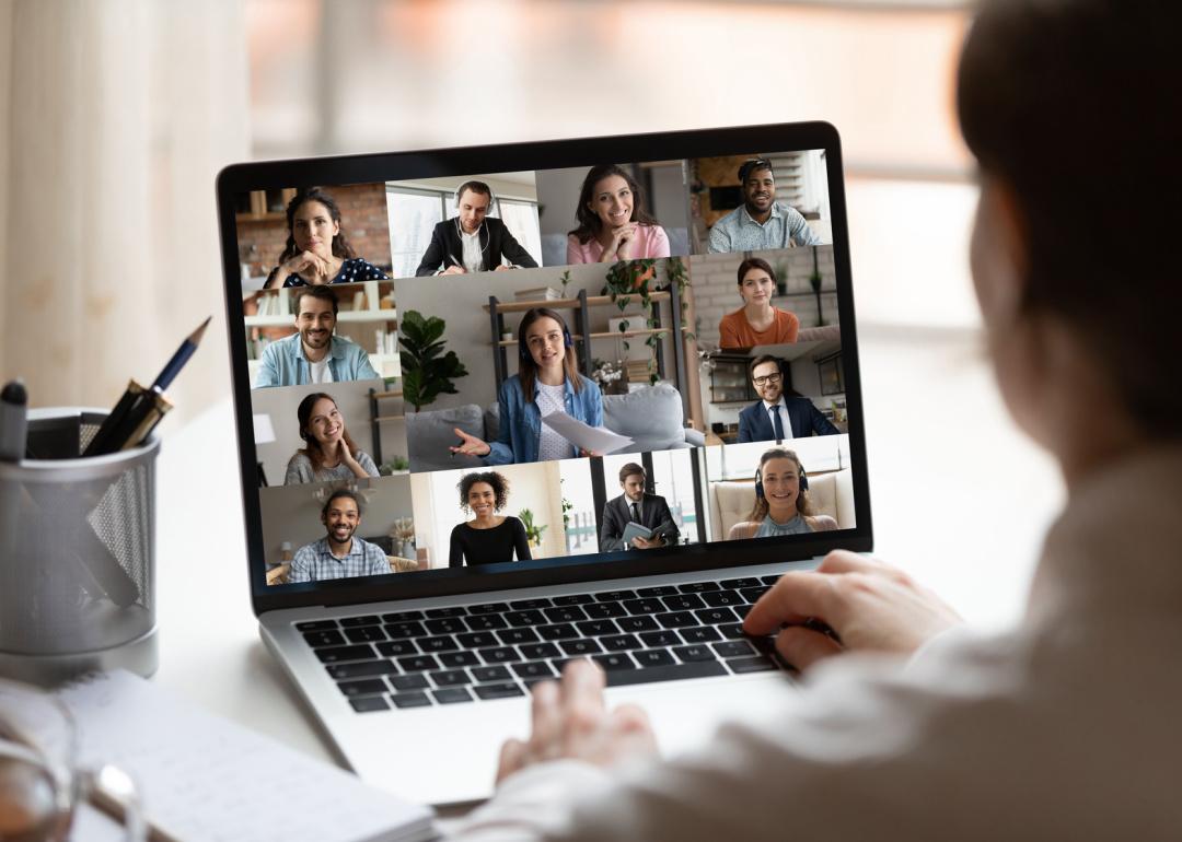Person working with remote team on video chat.