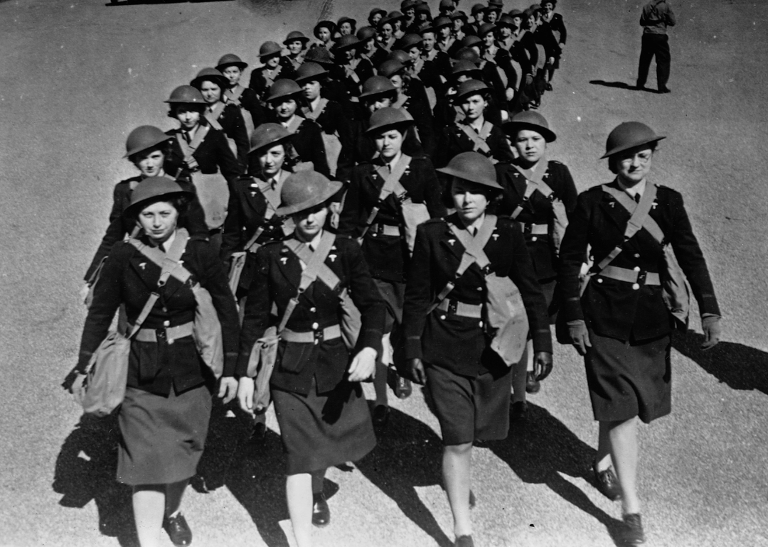 American Army nurses march in full war gear.