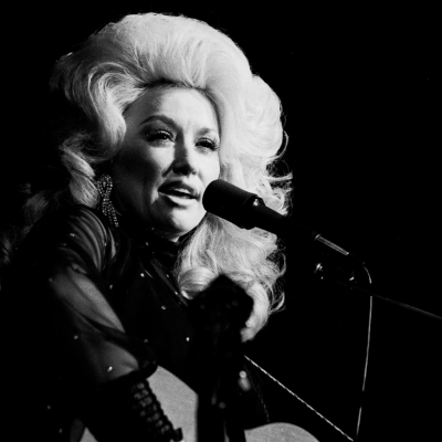 Dolly Parton performing onstage.