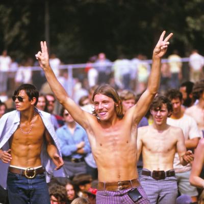 Man holds up peace signs at the Woodstock Music Festival, New York, US, 16th August 1969. 