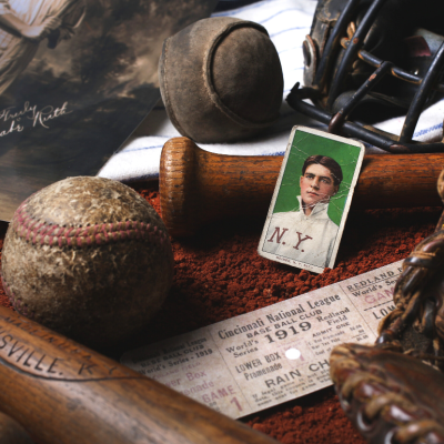A collection of vintage baseball memorabilia including a baseball card of Babe Ruth