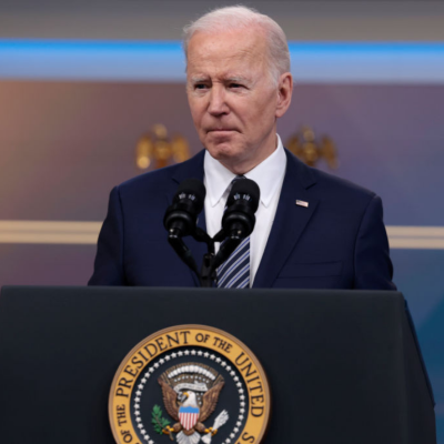 President Biden stands at a podium while discussing the release of oil from Strategic Petroleum Reserve.