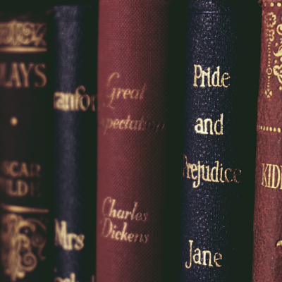 Closeup of classic books, like "Pride and Prejudice," on a shelf.