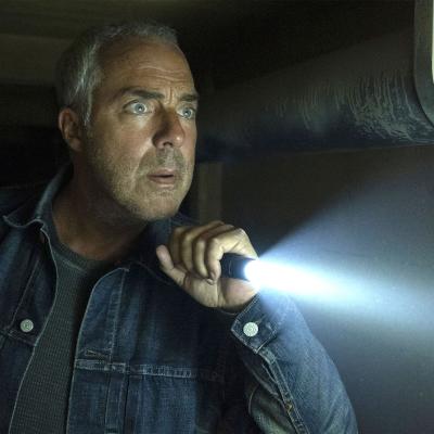 Titus Welliver shines a flashlight as Detective Bosch on "Bosch: Legacy"