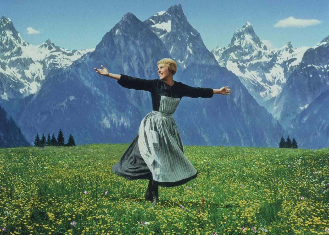 Julie Andrews spins in front of the mountains as Maria von Trapp in "The Sound of Music"