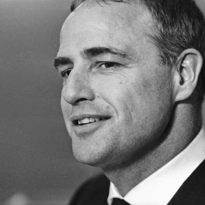 Actor and director Marlon Brando gives a half-smile during a Hollywood event.