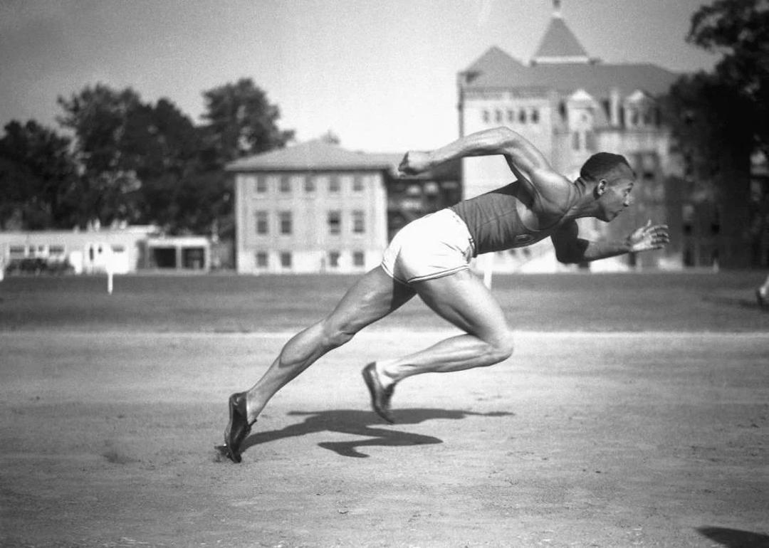 Jesse Owens, Ohio State's sensational athlete, in the midst of running a sprint.