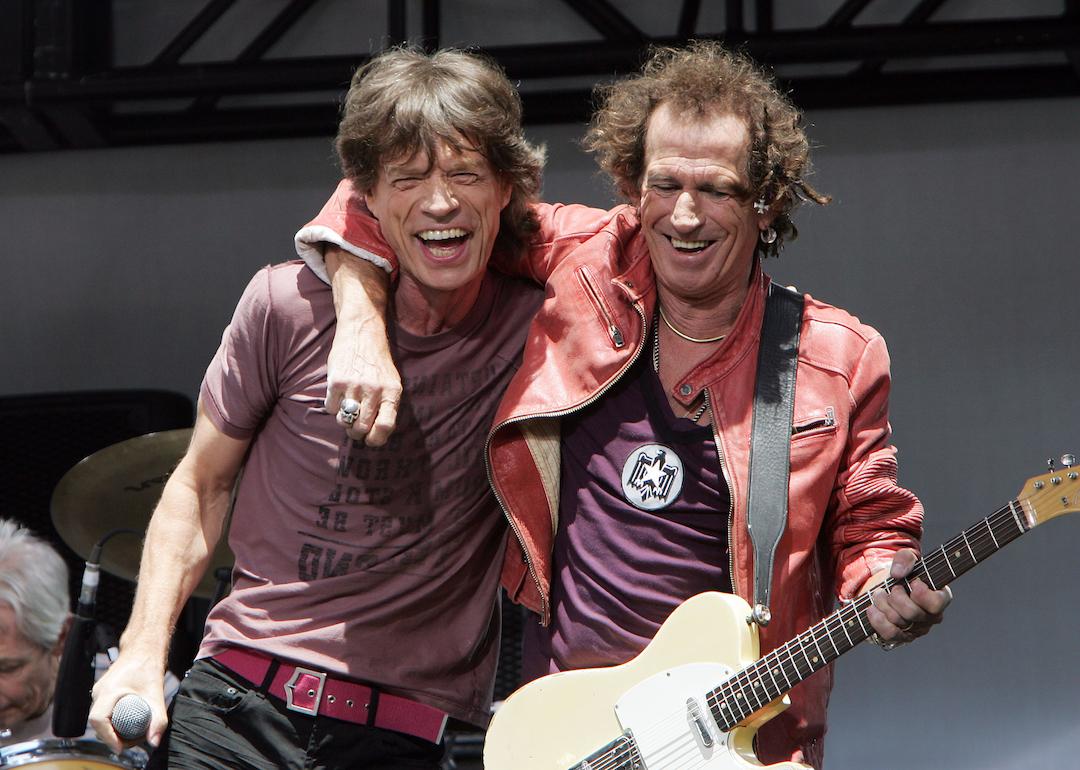 Mick Jagger and Keith Richards of The Rolling Stones perform onstage during a press conference to announce a world tour at the Julliard Music School May 10, 2005 in New York City. 