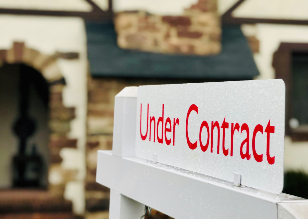 Under contract sign in front of house