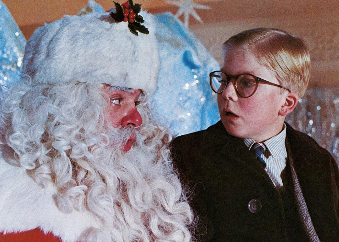 Peter Billingsley sits on Santa's lap in a scene from the 1983 comedy 'A Christmas Story.'