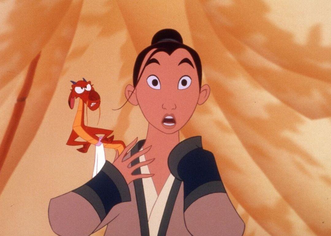 Mulan (voiced by Ming-Na Wen) and Mushu (voiced by Eddie Murphy) looking shocked in this image from the Disney animated princess movie "Mulan"