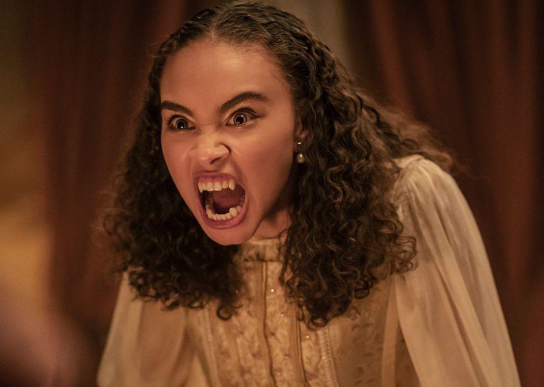 Bailey Bass as Claudia showing her teeth on the 2022 AMC series 'Interview with the Vampire.'
