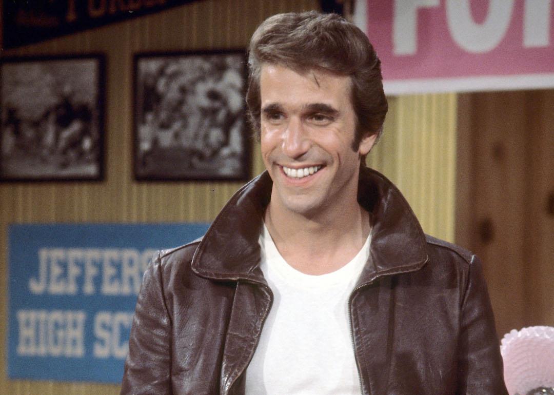 Henry Winkler wearing a brown leather jacket and white t-shirt as Arthur Fonzarelli, aka The Fonz, in 'Happy Days,' in 1977.
