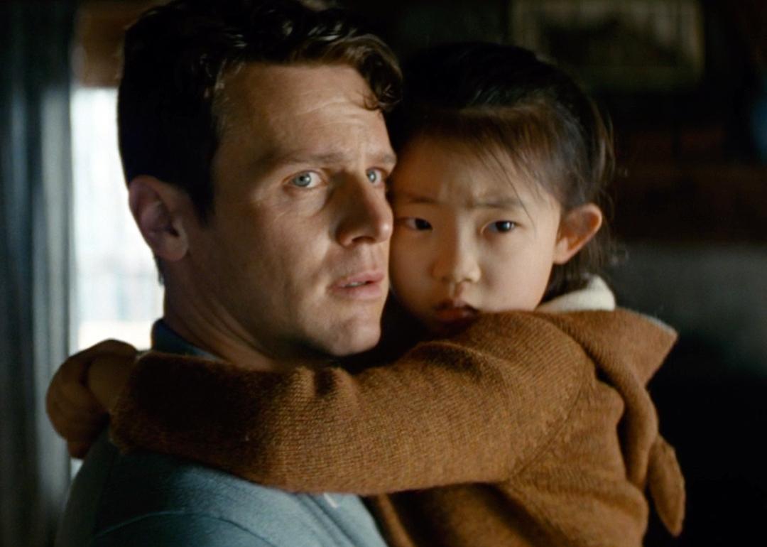 Jonathan Groff and Kristen Cui embracing one another in 'Knock at the Cabin.'