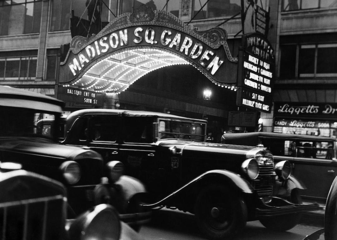 Cars in front of the Madison Square Garden marquee in New York City in the 1920s.