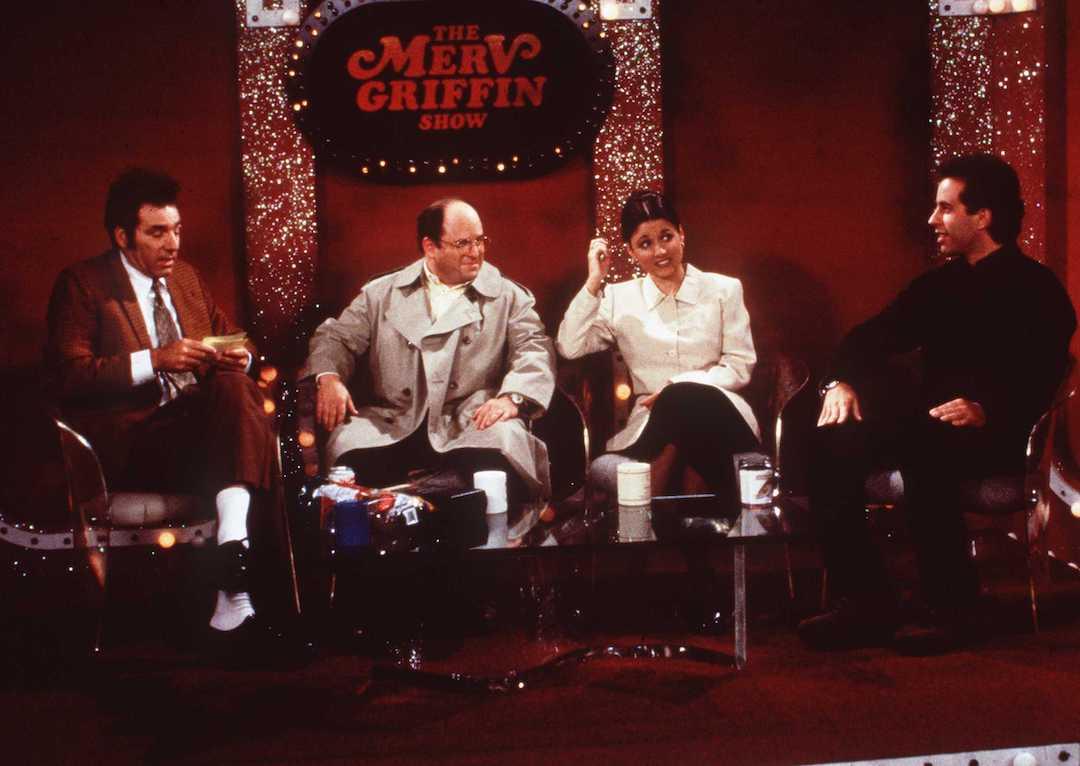 Actor Michael Richards as Cosmo Kramer, Jason Alexander as George Costanza, Julia Louis-Dreyfus as Elaine Benes, and Jerry Seinfeld as himself on the 1997 'Seinfeld' episode 'The Merv Griffin Show.'